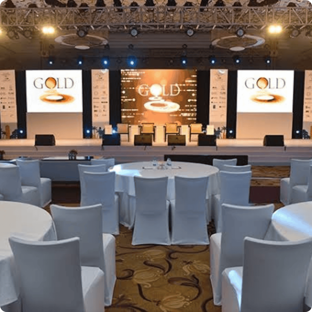 Stage with lighting and seating arrangement for a professional event.