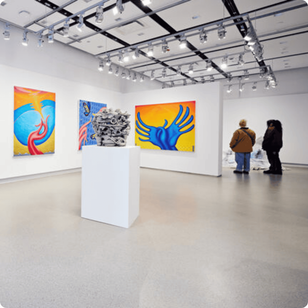 Modern art gallery showcasing vibrant paintings and sculptures.